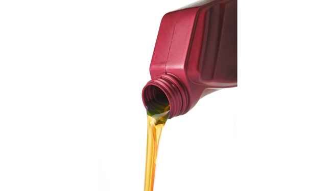 Pouring Lawn Mower Oil