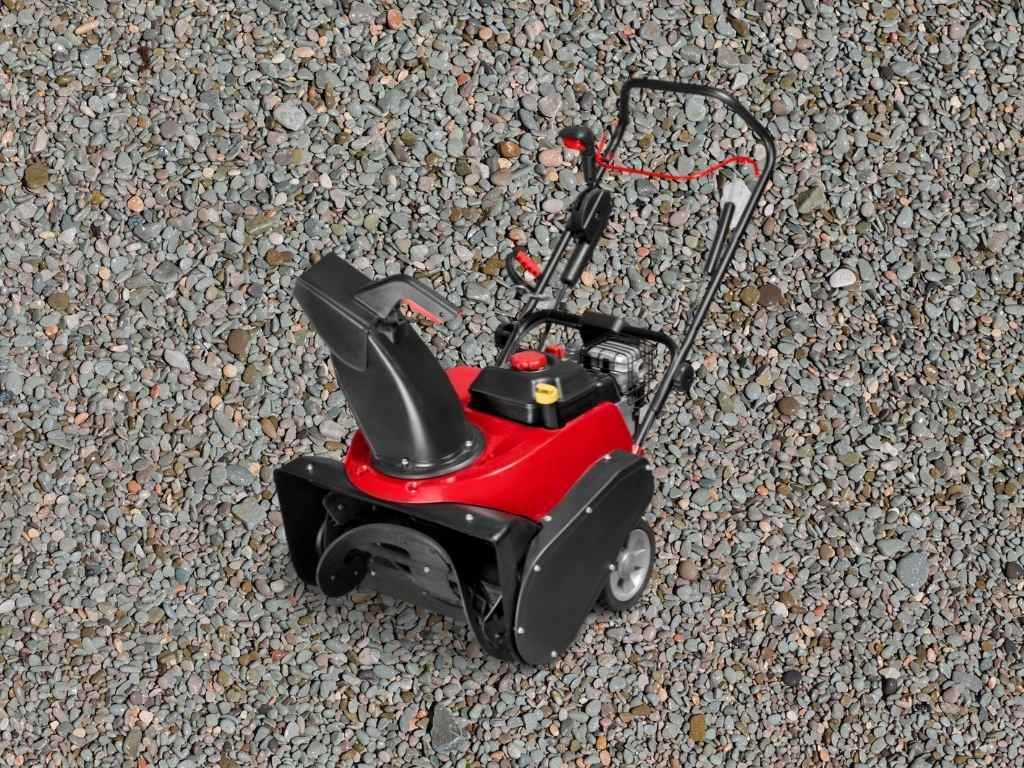 snow blower on gravel driveway